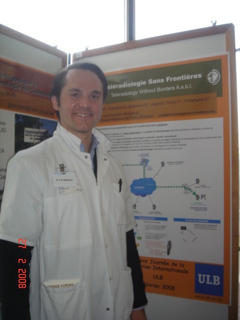 Dr. Jean-Baptiste Niedercorn beside the TWB poster, ULB International Day, February 2008